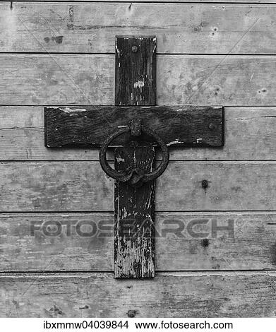 Picture - Weathered cross on a wooden wall. Fotosearch