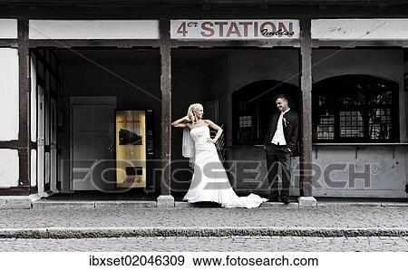 Stock Photo - "Wedding, bride and groom in an old bus station". Fotosearch