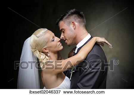 Stock Photo - "Wedding, bride and groom shortly before kissing". Fotosearch