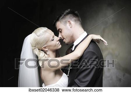 Stock Photo - "Wedding, bride and groom shortly before kissing". Fotosearch