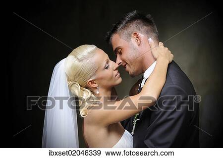 Stock Photo - "Wedding, bride and groom shortly before kissing". Fotosearch