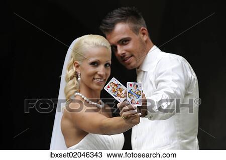 "Wedding, bride and groom with playing cards, queen and jack of hearts" View Large Photo Image Stock Image - "Wedding, bride and groom with playing cards, queen and jack of hearts". Fotosearch