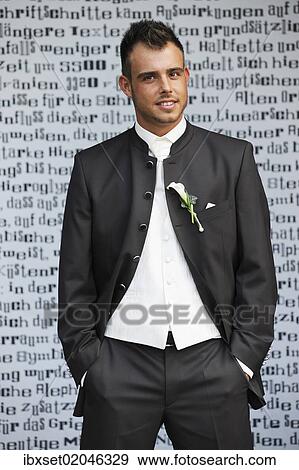 "Wedding, groom standing in front of a wall with letters" View Large Photo Image Stock Photo - "Wedding, groom standing in front of a wall with letters". Fotosearch
