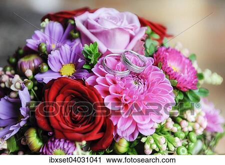 Wedding rings on wedding bouquet View Large Photo Image Stock Image - Wedding rings on wedding bouquet. Fotosearch