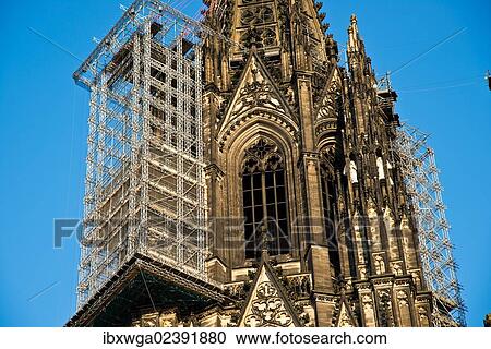 "West facade, northern steeple of Cologne Cathedral with suspended scaffolding for renovations, Cologne, North Rhine-Westphalia, Germany, Europe, PublicGround, Europe" View Large Photo Image Stock Image - "West facade, northern steeple of Cologne Cathedral with suspended scaffolding for renovations, Cologne, North Rhine-Westphalia, Germany, Europe, PublicGround, Europe". Fotosearch