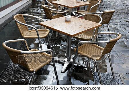 "Wet bistro table and chairs, Las Palmas, Gran Canaria, Spain, Europe" View Large Photo Image Stock Photography - "Wet bistro table and chairs, Las Palmas, Gran Canaria, Spain, Europe". Fotosearch