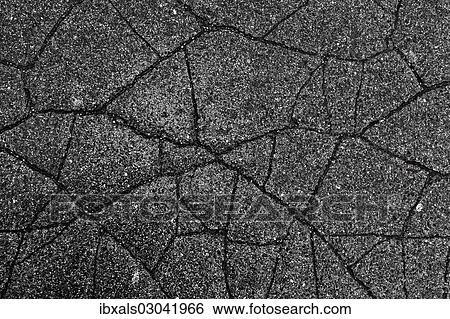 Wet cracked asphalt View Large Photo Image Stock Photograph - Wet cracked asphalt. Fotosearch