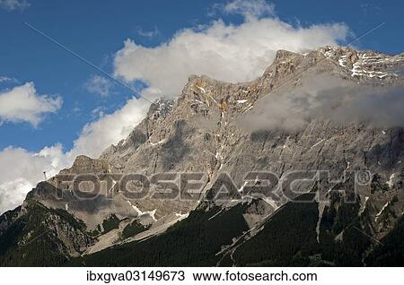 "Wetterstein Mountains from the west with Zugspitze Mountain and Schneefernerkopf Mountain, Ehrwald, Tyrol, Austria, Europe" View Large Photo Image Stock Image - "Wetterstein Mountains from the west with Zugspitze Mountain and Schneefernerkopf Mountain, Ehrwald, Tyrol, Austria, Europe". Fotosearch