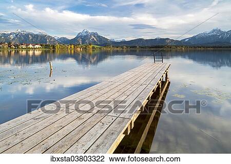 "Wharf on Hopfensee lake, near Fussen, East Allgau, Bavaria, Germany, Europe" View Large Photo Image Stock Image - "Wharf on Hopfensee lake, near Fussen, East Allgau, Bavaria, Germany, Europe". Fotosearch