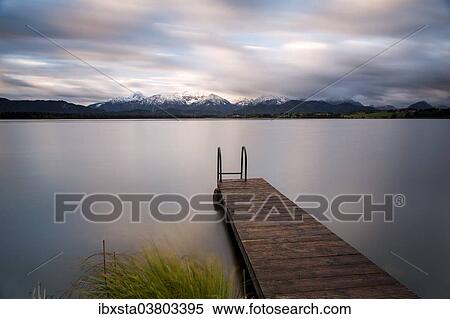 "Wharf on Hopfensee lake, near Fussen, East Allgau, Bavaria, Germany, Europe" View Large Photo Image Stock Photography - "Wharf on Hopfensee lake, near Fussen, East Allgau, Bavaria, Germany, Europe". Fotosearch