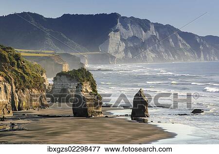"White Cliffs Beach at low tide, rocks in the surf, Ahititi, Taranaki, North Island, New Zealand, Oceania" View Large Photo Image Stock Photo - "White Cliffs Beach at low tide, rocks in the surf, Ahititi, Taranaki, North Island, New Zealand, Oceania". Fotosearch
