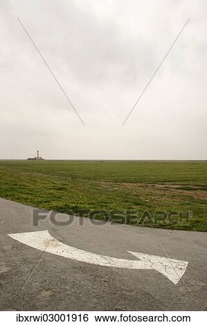 "White directional arrow on a road near Westerhever lighthouse, Westerheversand, Eiderstedt, North Frisia, Schleswig-Holstein, Germany, Europe" View Large Photo Image Stock Photograph - "White directional arrow on a road near Westerhever lighthouse, Westerheversand, Eiderstedt, North Frisia, Schleswig-Holstein, Germany, Europe". Fotosearch