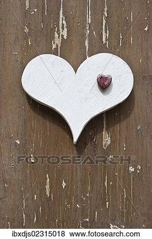 White wooden heart on a wooden wall View Large Photo Image Stock Photo - White wooden heart on a wooden wall. Fotosearch
