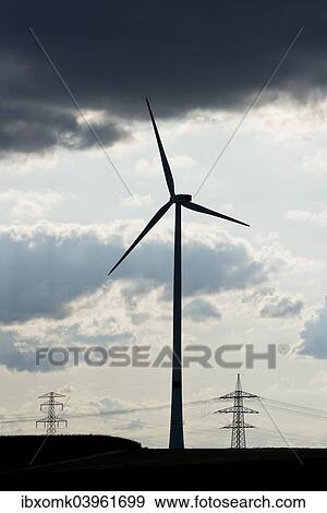 "Wind turbine, utility poles and power lines, silhouettes, Oening, Bavaria, Germany, Europe" View Large Photo Image Stock Photo - "Wind turbine, utility poles and power lines, silhouettes, Oening, Bavaria, Germany, Europe". Fotosearch