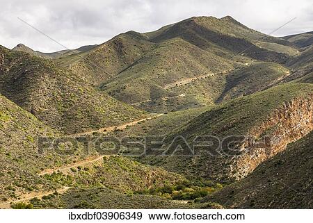 "Winding road, serpentines, gravel road in Gamkaskloof or """"Die Hel"""" Valley, Swartberg, Western Cape, South Africa, Africa" View Large Photo Image Stock Photo - "Winding road, serpentines, gravel road in Gamkaskloof or """"Die Hel"""" Valley, Swartberg, Western Cape, South Africa, Africa". Fotosearch