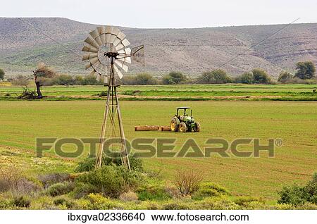"Windmill of an irrigation pump and a tractor in a field, Calvinia, Western Cape province, South Africa, Africa" View Large Photo Image Stock Image - "Windmill of an irrigation pump and a tractor in a field, Calvinia, Western Cape province, South Africa, Africa". Fotosearch