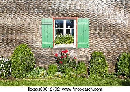 Stock Image - "Window with green shutters, with flowers in the front, Reichenau, Baden-Wurttemberg, Germany, Europe". Fotosearch
