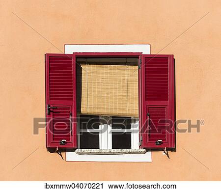 Stock Image - "Window with red shutters and blinds, Corte, Corsica, France, Europe". Fotosearch