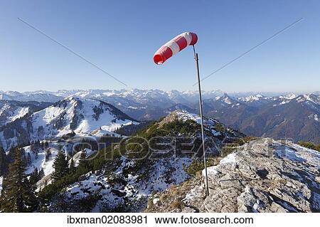 Stock Image - "Windsock on the summit of Mt Wallberg, Mt Setzberg, left, Mangfall mountains, Upper Bavaria, Bavaria, Germany, Europe, PublicGround, Europe". Fotosearch