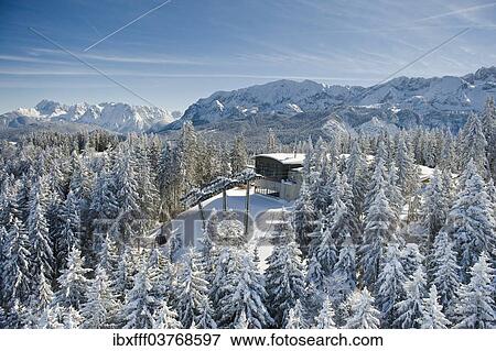 Stock Photo - "Winter landscape with the Hausberg Gondola Lift, Garmisch-Partenkirchen, Bavaria, Germany, Europe". Fotosearch