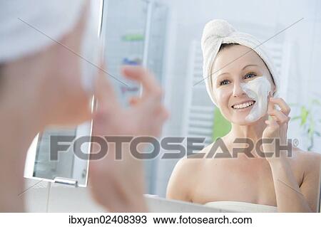 "Woman, 30+, in the bathroom applying a facial mask" View Large Photo Image Stock Image - "Woman, 30+, in the bathroom applying a facial mask". Fotosearch
