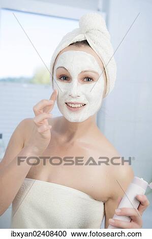 "Woman, 30+, in the bathroom applying a facial mask" View Large Photo Image Stock Image - "Woman, 30+, in the bathroom applying a facial mask". Fotosearch