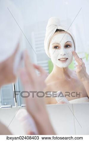 "Woman, 30+, in the bathroom applying a facial mask" View Large Photo Image Stock Image - "Woman, 30+, in the bathroom applying a facial mask". Fotosearch