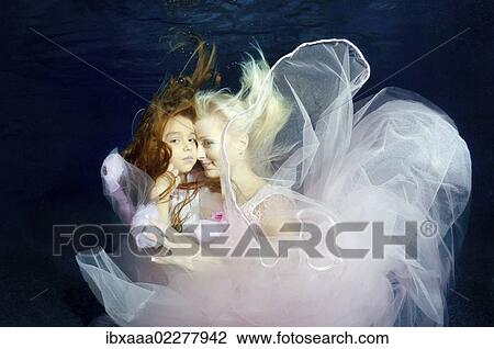 "Woman and girl, underwater models, presenting fashion in pool, Odessa, Ukraine, Eastern Europe, Europe" View Large Photo Image Stock Image - "Woman and girl, underwater models, presenting fashion in pool, Odessa, Ukraine, Eastern Europe, Europe". Fotosearch
