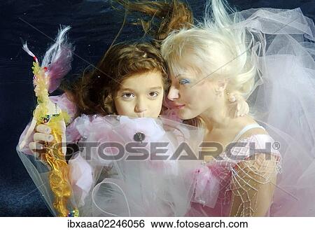 "Woman and girl, underwater models, presenting fashion in pool, Odessa, Ukraine, Eastern Europe, Europe" View Large Photo Image Stock Photograph - "Woman and girl, underwater models, presenting fashion in pool, Odessa, Ukraine, Eastern Europe, Europe". Fotosearch