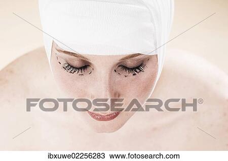 Woman before undergoing plastic surgery with markings on her face View Large Photo Image Stock Image - Woman before undergoing plastic surgery with markings on her face. Fotosearch