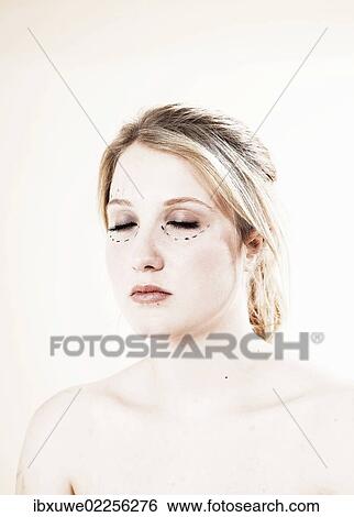 Woman before undergoing plastic surgery with markings on her face View Large Photo Image Stock Photograph - Woman before undergoing plastic surgery with markings on her face. Fotosearch