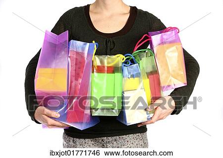 Woman carrying bags full of gifts View Large Photo Image Stock Photograph - Woman carrying bags full of gifts. Fotosearch
