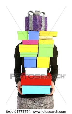 Woman carrying cardboard boxes with gifts View Large Photo Image Picture - Woman carrying cardboard boxes with gifts. Fotosearch