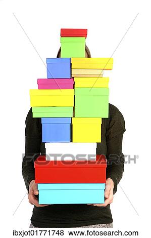 Stock Photo - Woman carrying cardboard boxes with gifts. Fotosearch