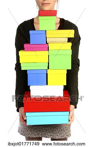 Woman carrying cardboard boxes with gifts View Large Photo Image Stock Photo - Woman carrying cardboard boxes with gifts. Fotosearch