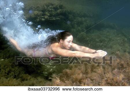 "Woman diving into the water, Black Sea, Crimea, Ukraine, Europe" View Large Photo Image Stock Photograph - "Woman diving into the water, Black Sea, Crimea, Ukraine, Europe". Fotosearch