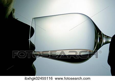 "Woman drinking red wine, silhouette" View Large Photo Image Stock Photograph - "Woman drinking red wine, silhouette". Fotosearch