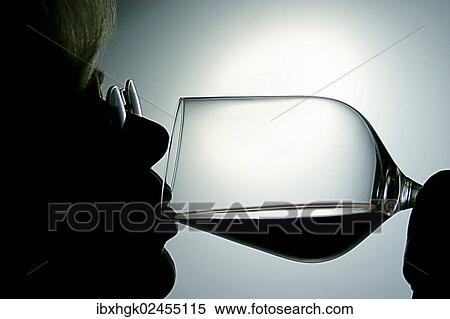 Stock Photography - "Woman drinking red wine, silhouette". Fotosearch
