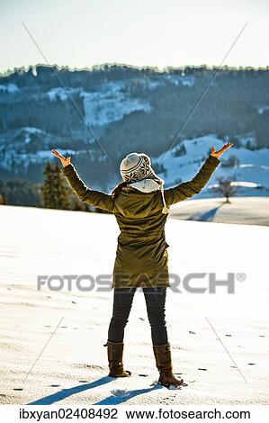 "Woman enjoying the winter landscape in snow, Switzerland, Europe" View Large Photo Image Stock Image - "Woman enjoying the winter landscape in snow, Switzerland, Europe". Fotosearch