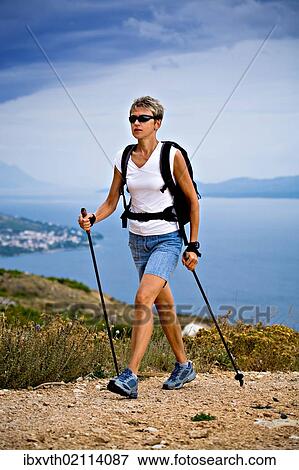 "Woman hiking at the seaside, Omis, Adriatic coast, Croatia, Europe" View Large Photo Image Stock Photo - "Woman hiking at the seaside, Omis, Adriatic coast, Croatia, Europe". Fotosearch