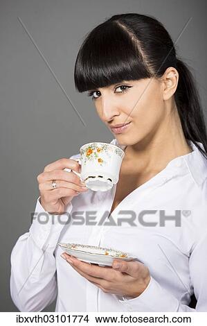 "Woman holding a cup of tea, Germany, Europe" View Large Photo Image Picture - "Woman holding a cup of tea, Germany, Europe". Fotosearch
