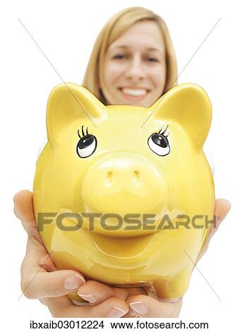 Woman holding a piggy bank View Large Photo Image Picture - Woman holding a piggy bank. Fotosearch