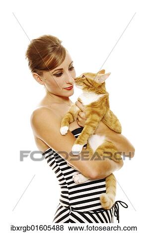 Stock Photo - Woman in 60s look holding a cat. Fotosearch