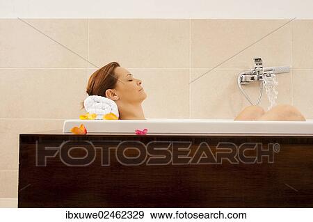 Woman in a bathtub View Large Photo Image Stock Photo - Woman in a bathtub. Fotosearch