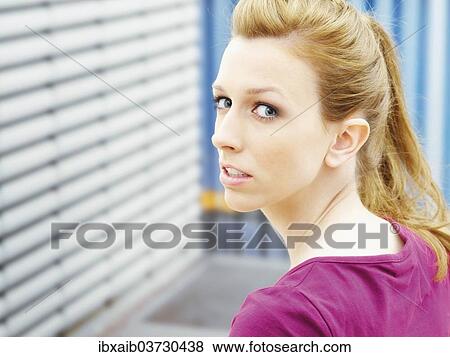 Woman looking over her shoulder View Large Photo Image Stock Photo - Woman looking over her shoulder. Fotosearch