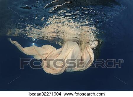 "Woman presenting underwater fashion in pool, Odessa, Ukraine, Eastern Europe, Europe" View Large Photo Image Picture - "Woman presenting underwater fashion in pool, Odessa, Ukraine, Eastern Europe, Europe". Fotosearch