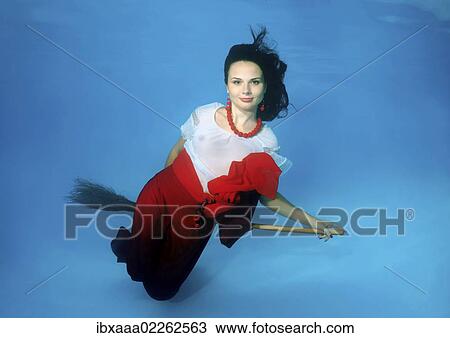 Woman presenting underwater fashion in a pool View Large Photo Image Stock Image - Woman presenting underwater fashion in a pool. Fotosearch