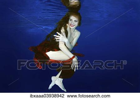 "Woman presenting underwater fashion in a pool, Russia, Europe" View Large Photo Image Stock Image - "Woman presenting underwater fashion in a pool, Russia, Europe". Fotosearch