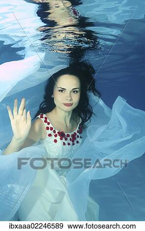 "Woman presenting underwater fashion in pool, Odessa, Ukraine, Eastern Europe, Europe" View Large Photo Image Stock Photo - "Woman presenting underwater fashion in pool, Odessa, Ukraine, Eastern Europe, Europe". Fotosearch