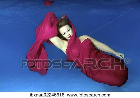 Stock Photograph - "Woman presenting underwater fashion in pool, Odessa, Ukraine, Eastern Europe, Europe". Fotosearch